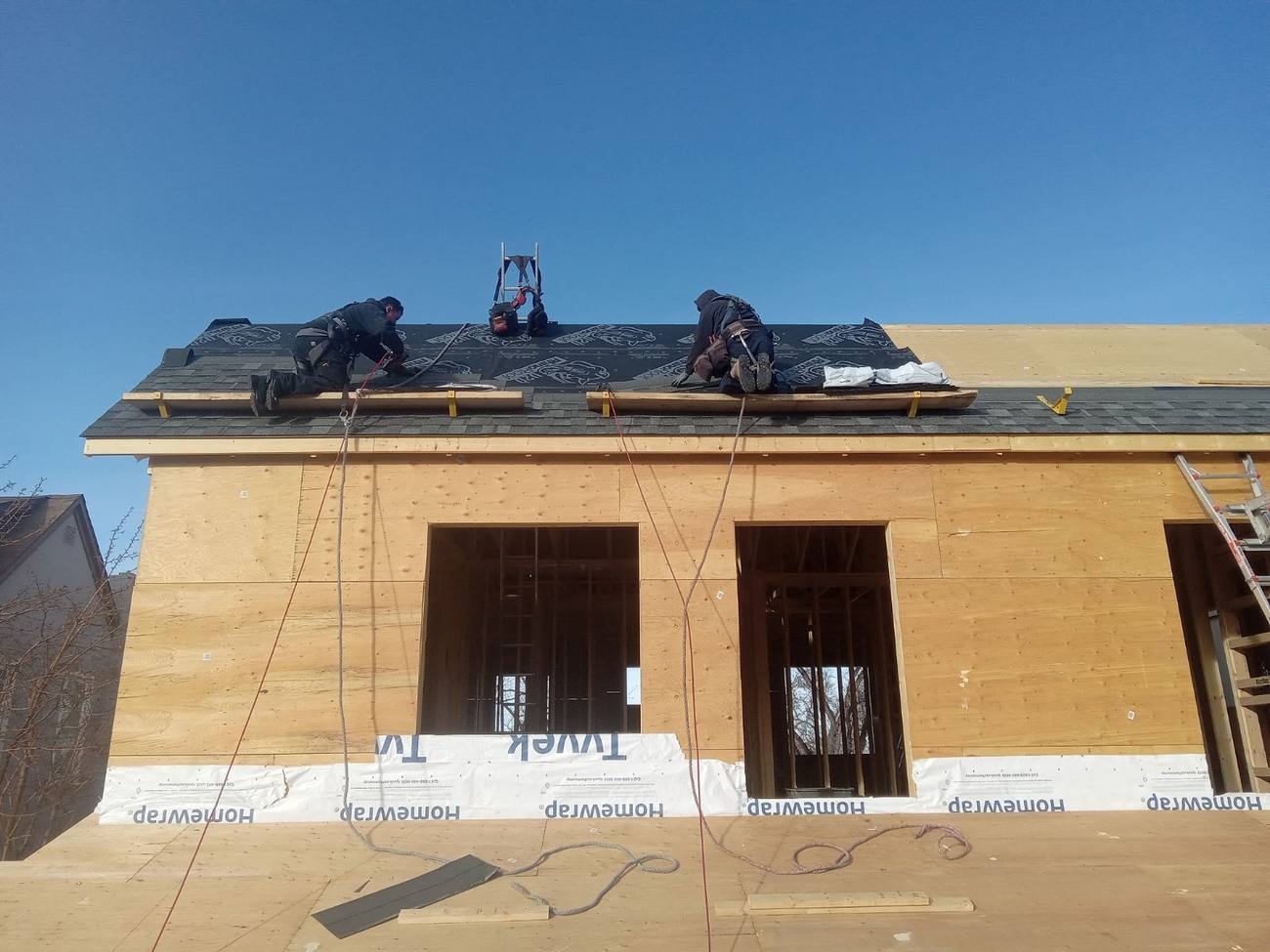 J Cubed Custom crew sheathing a roof deck